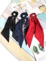 SUSULU bow detail on scrunchie emphasizing decorative tail that upgrades simple ponytails