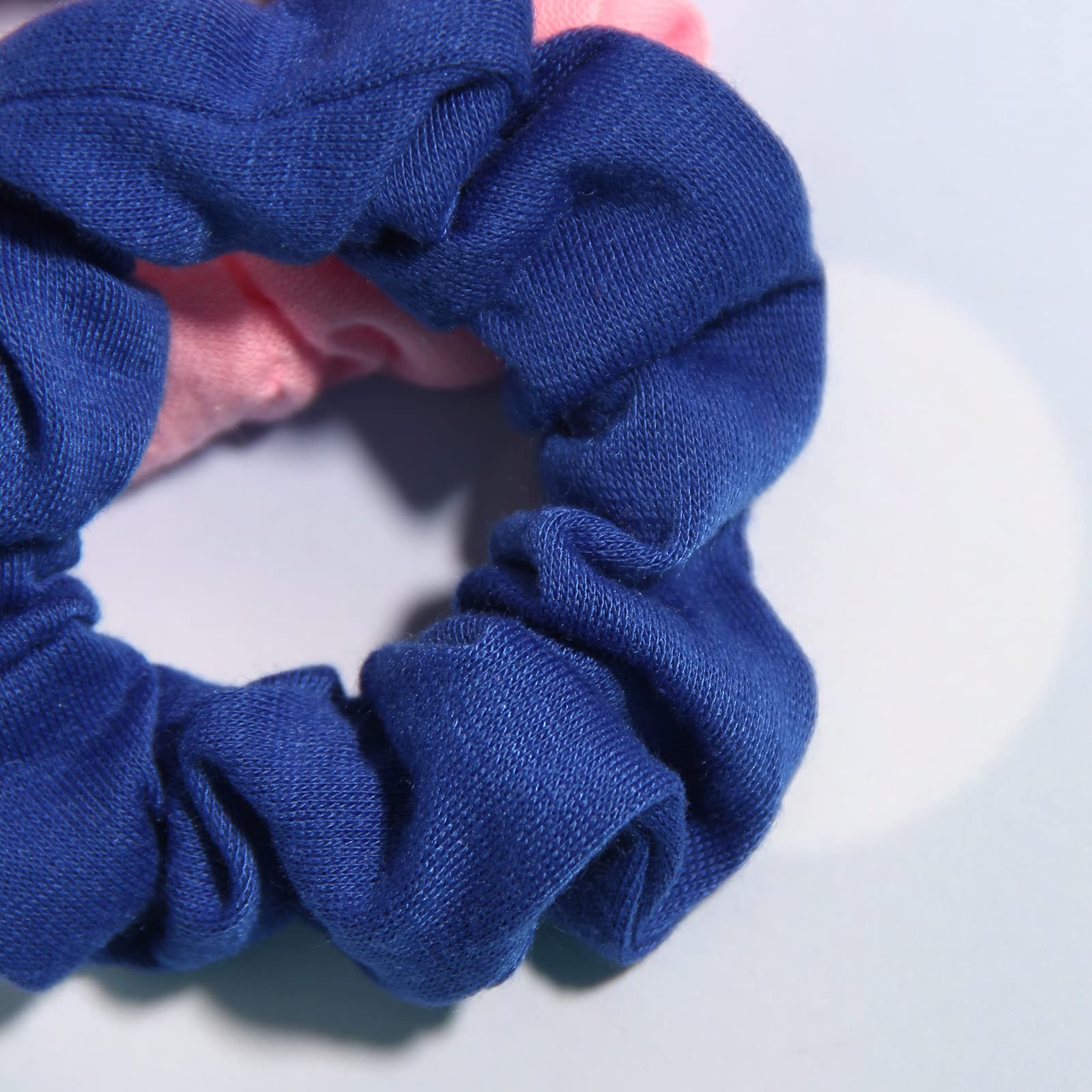 SUSULU scrunchie held in hand for scale and easy carrying convenience