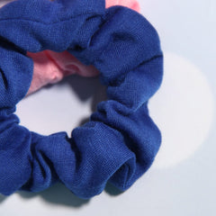 SUSULU scrunchie held in hand for scale and easy carrying convenience