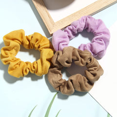 SUSULU scrunchies packed in a travel pouch for on-the-go convenience