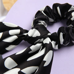 SUSULU scrunchie worn on wrist, doubles as a convenient accessory