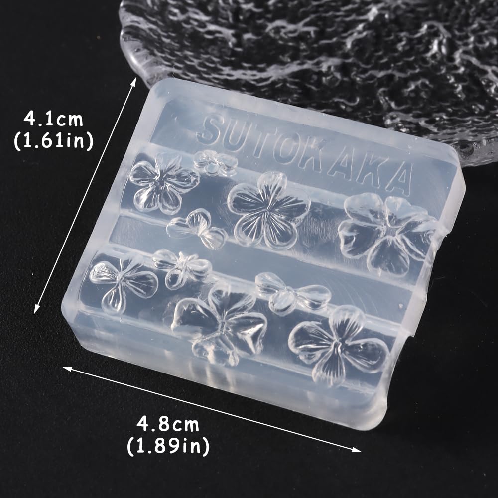 SUTOKAKA floral resin pieces attached to a phone case craft, showing multi-use decoration benefit