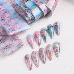 SUTOKAKA finished manicure lifestyle shot displaying floral foils giving polished look