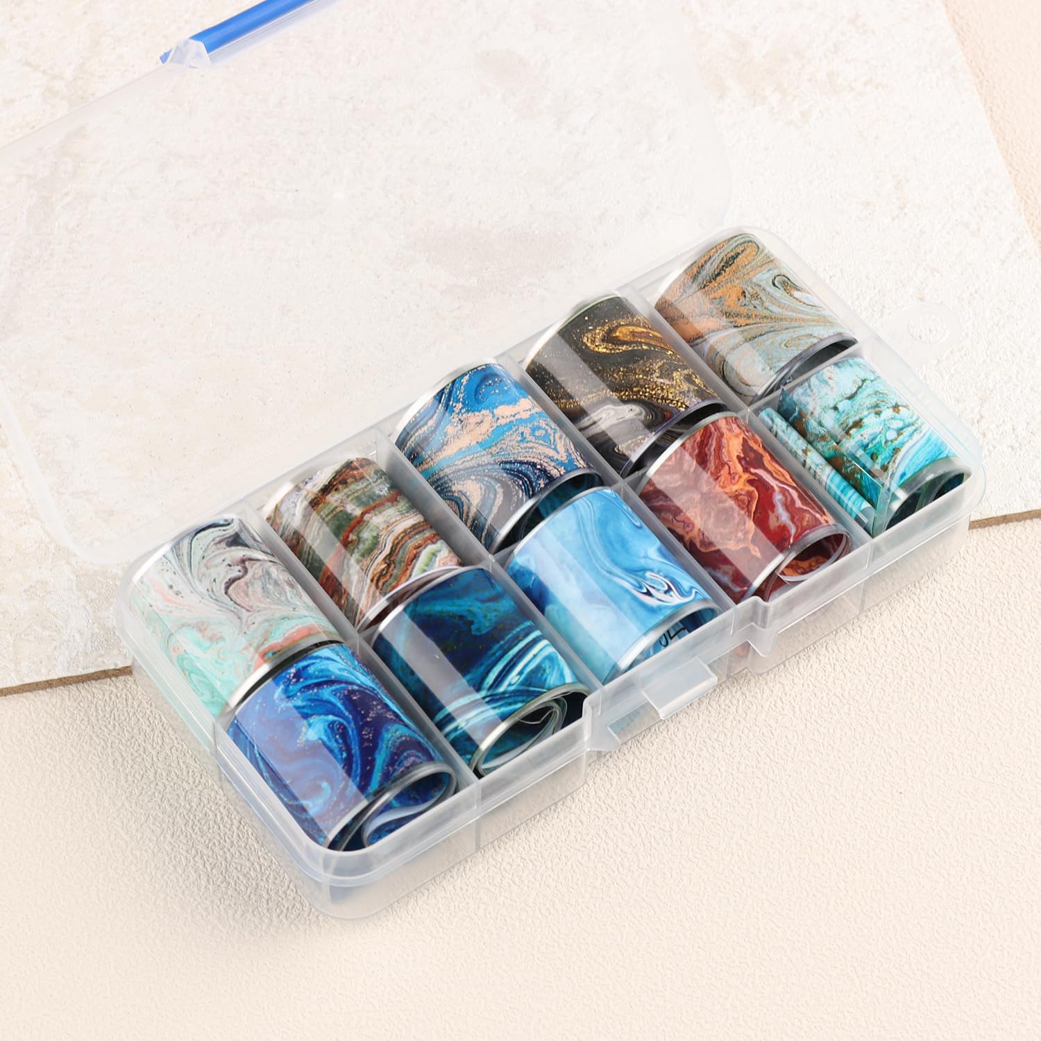 SUTOKAKA lifestyle shot hands with marble nails highlighting wearable elegance