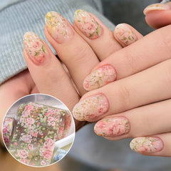 SUTOKAKA lifestyle manicure setting with hands and foils showing wearable floral style