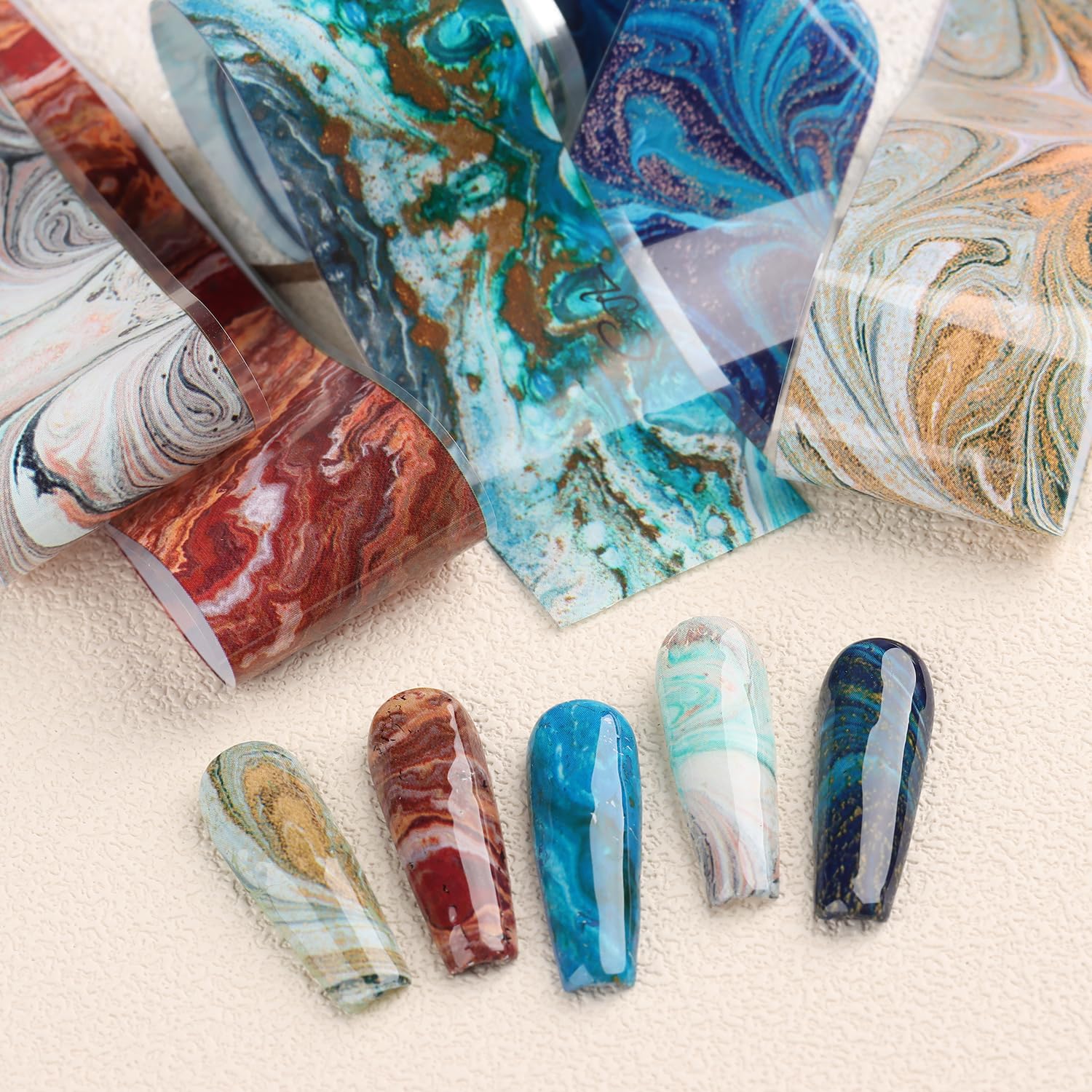 SUTOKAKA mixed nail accents showcasing varied marble patterns for styling ideas