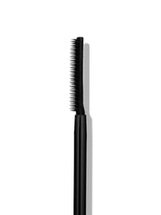 SWEED mascara size comparison next to coin showing compact travel benefit