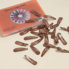 SWSTINLING clip securing a bun to show reliable hold during styling