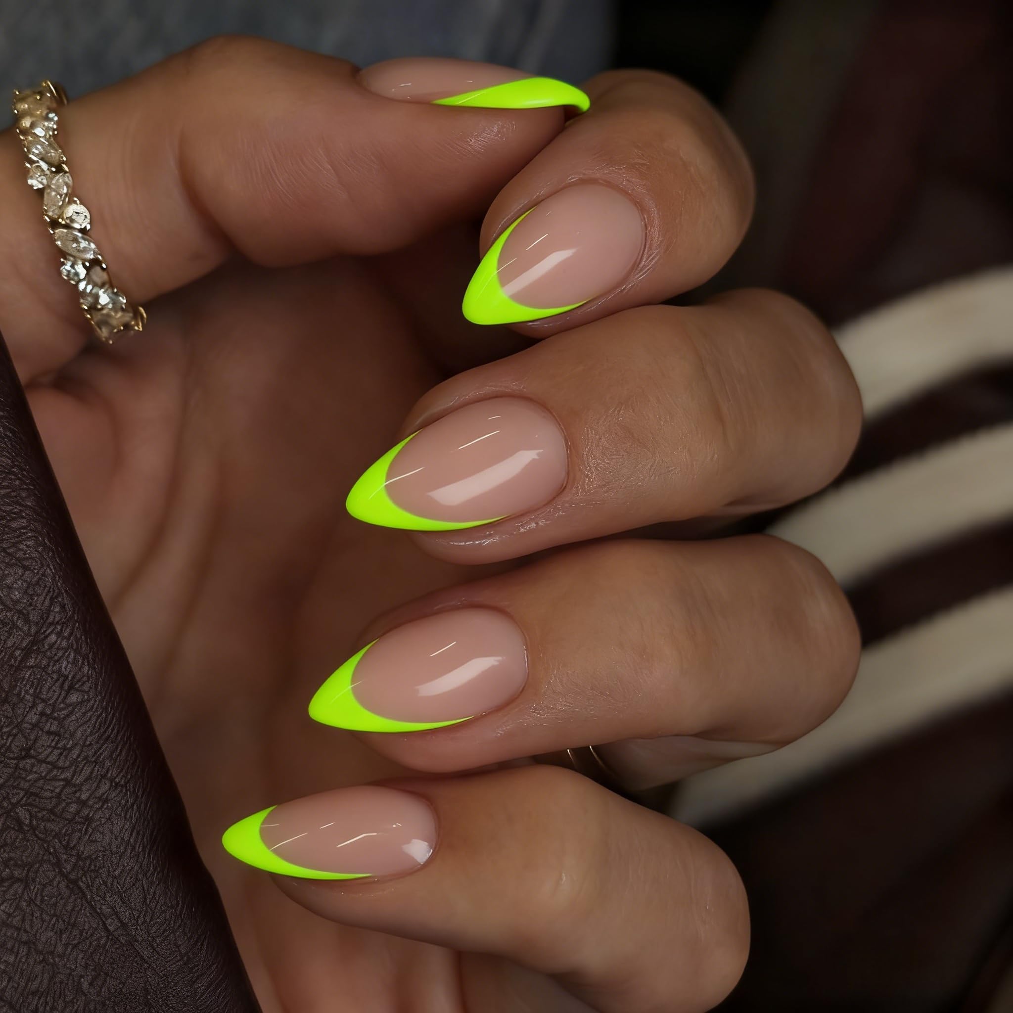 SXVME hand applying a press-on nail demonstrating quick at-home manicure benefit