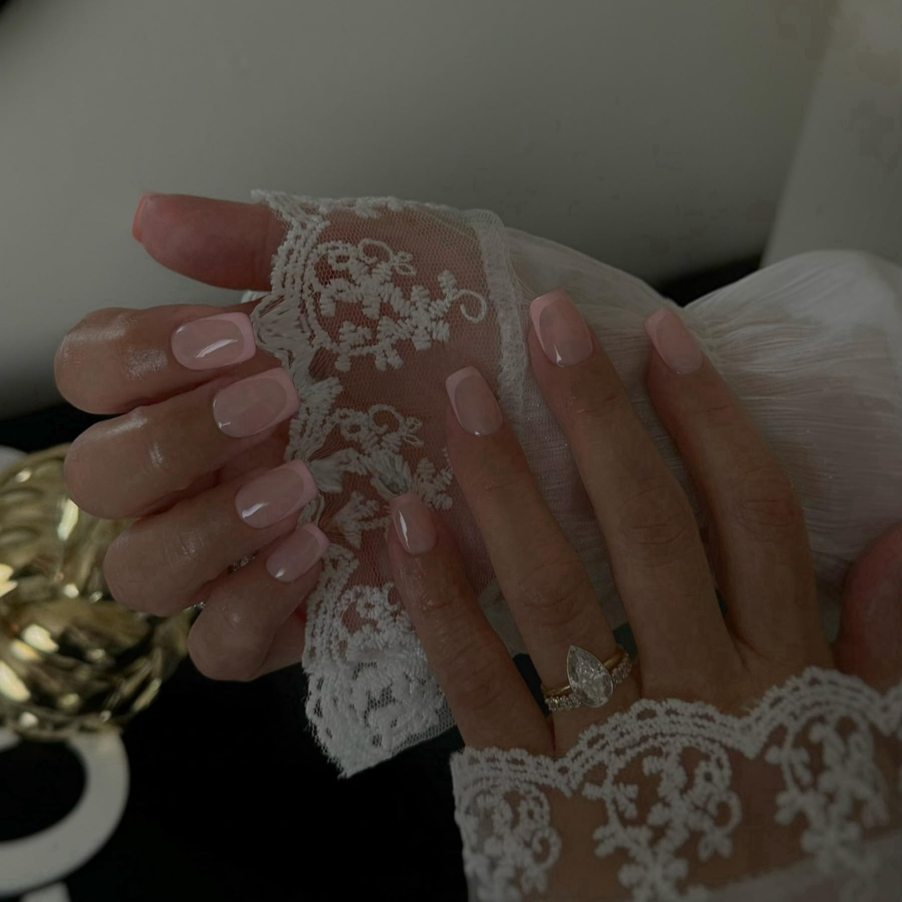 SXVME close-up of white French tip detail highlighting a natural salon finish