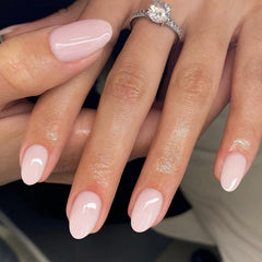 SXVME hand wearing short oval press-ons displaying natural look for daily wear