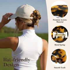SYGY clip holding hair in a neat bun under a baseball cap for convenience