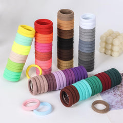SYGY size scale hand holding several ties to show stretch and grip