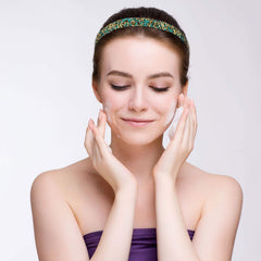 Syhood woman doing yoga wearing headband showing secure fit