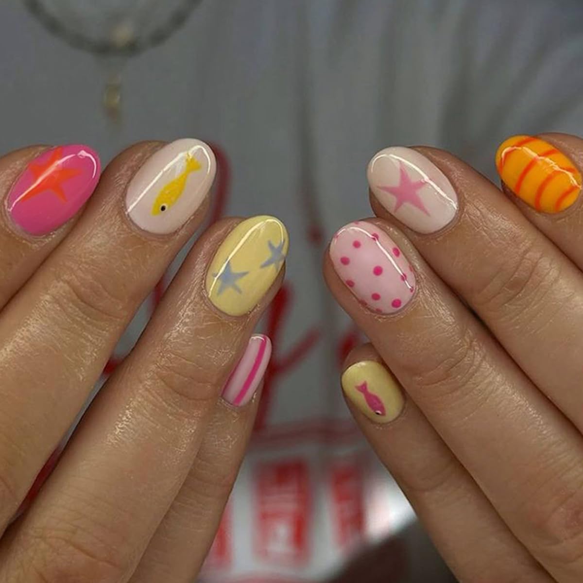 SYPAFG front packaging showing full 24-piece nail kit and bright designs