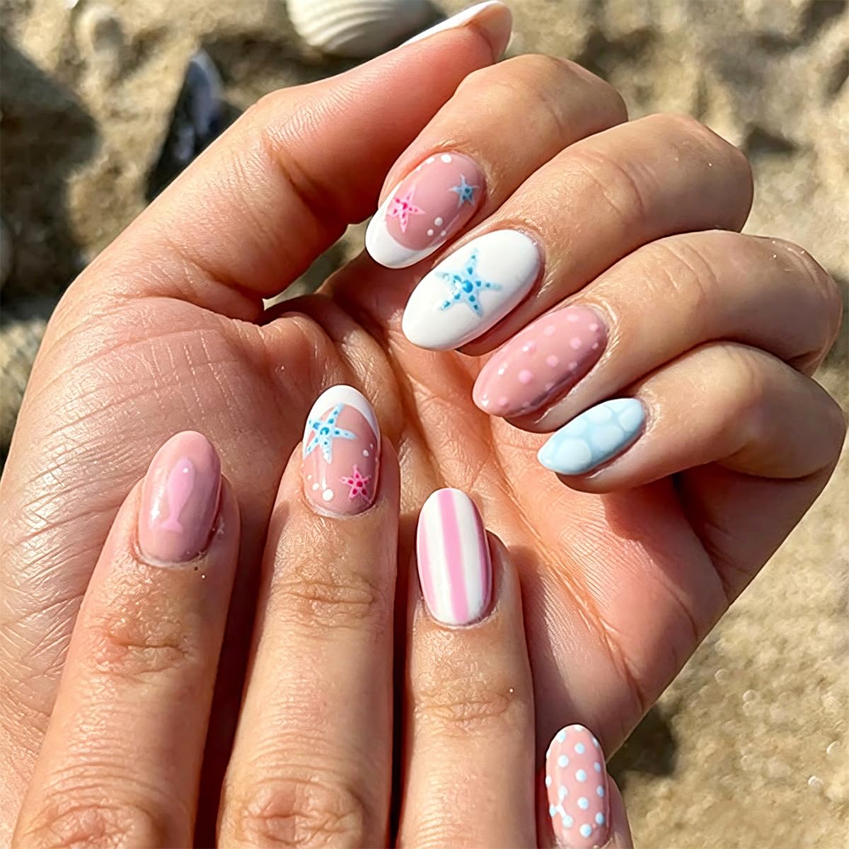 SYPAFG front packaging showing 24 glossy beach-themed press-on nails and kit contents, easy salon look