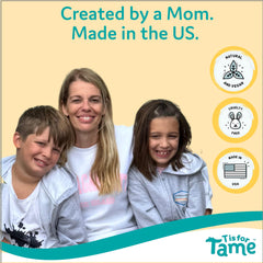 T is for Tame used on a smiling child outdoors keeping hair tidy and comfortable