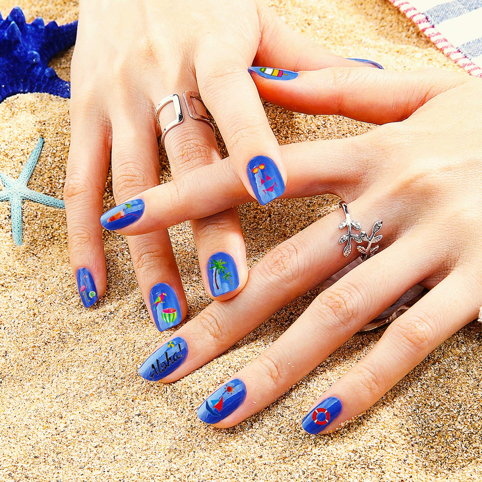 TailaiMei manicure on hands at beach setting illustrating seasonal, vibrant look