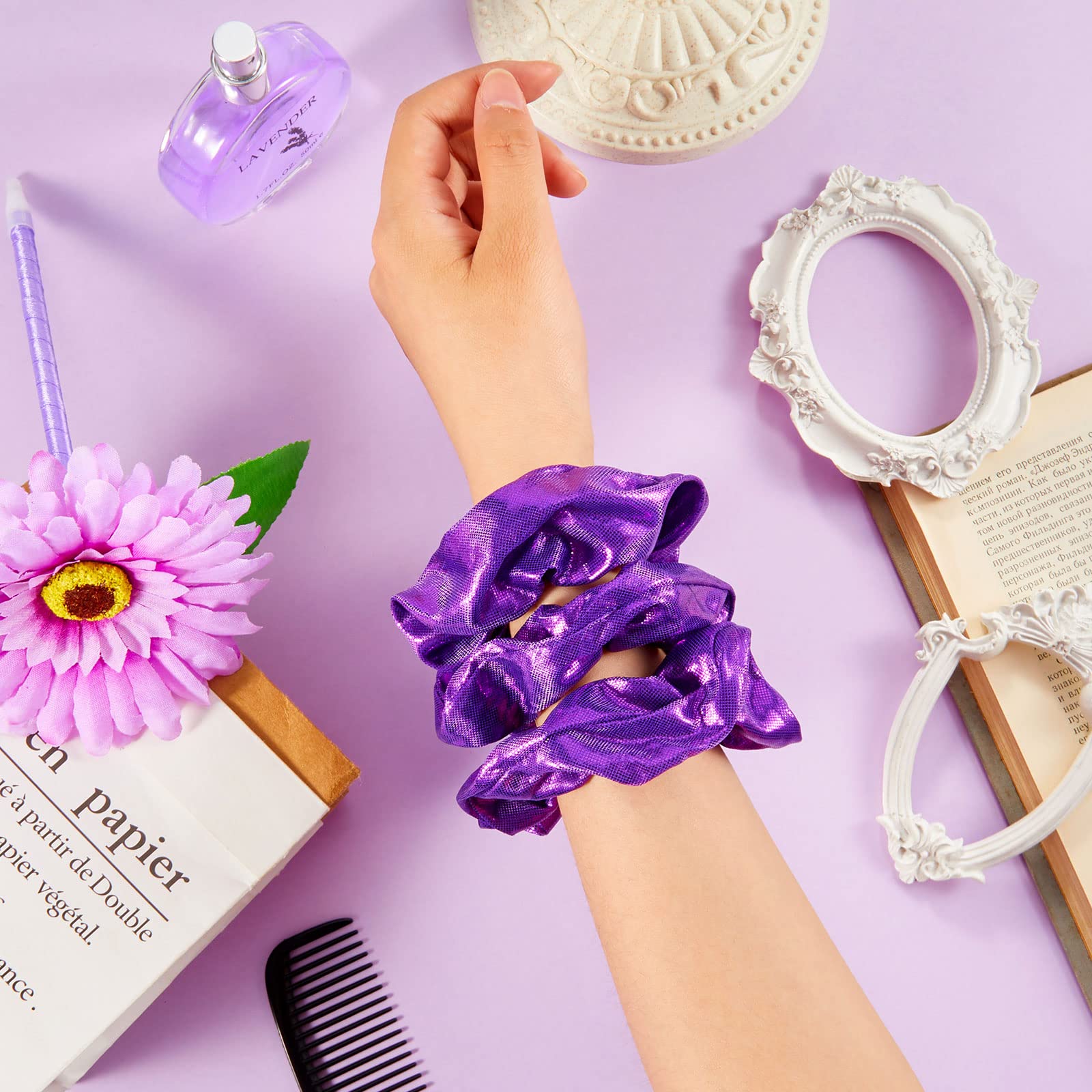Taiyin scrunchie next to hand for scale demonstrating compact, travel-ready benefit