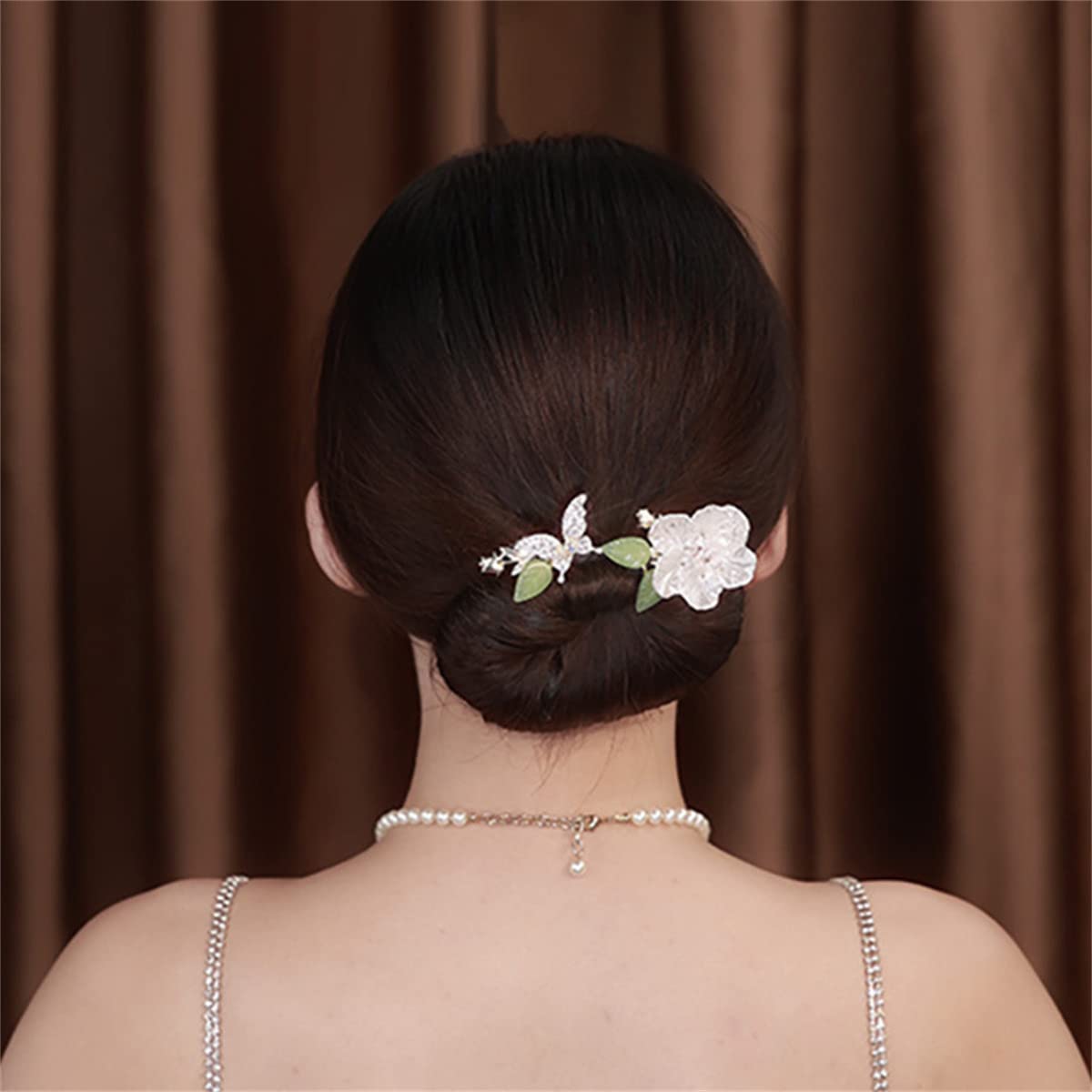 Takeberny finished French twist displaying smooth, professional-looking updo