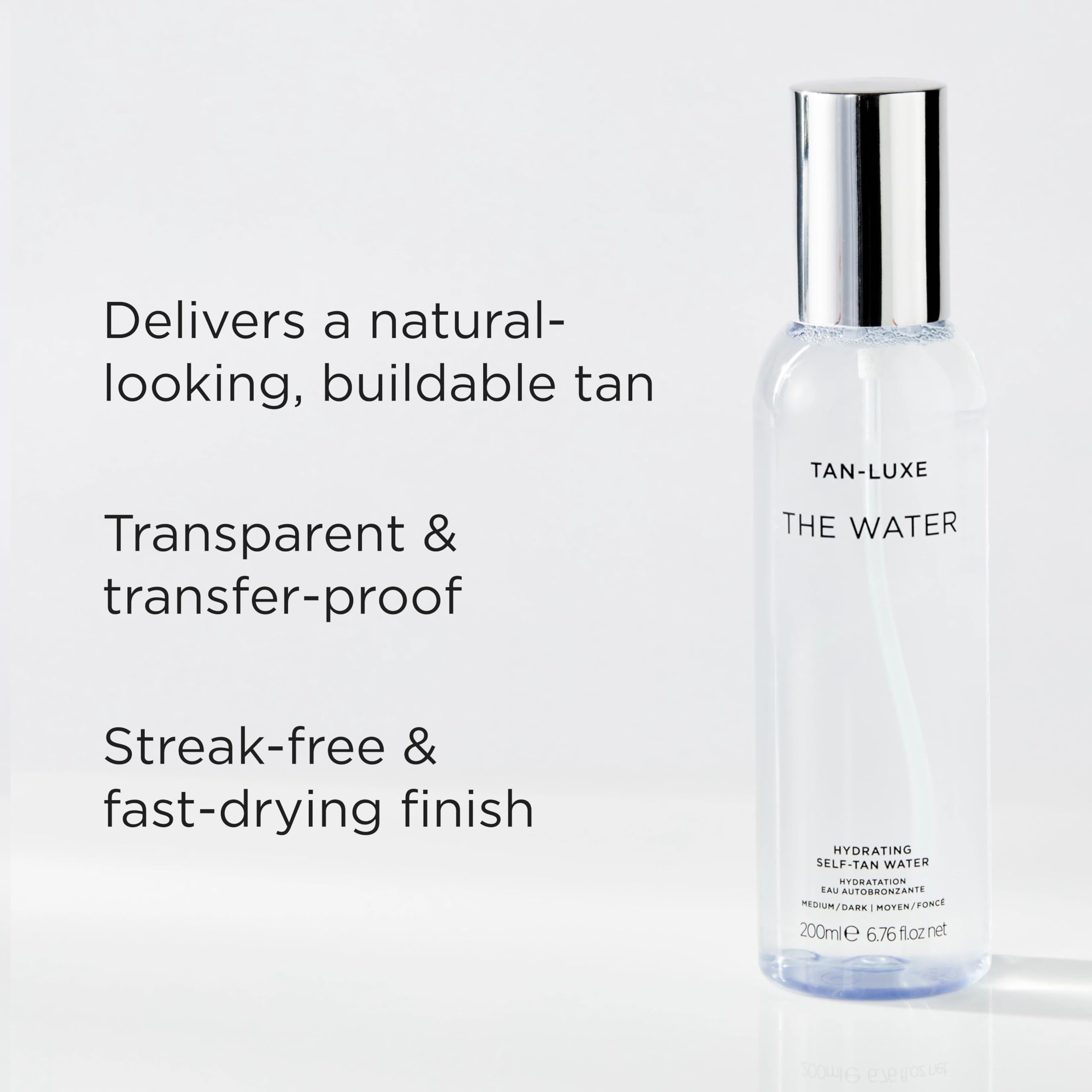 TAN-LUXE bottle in hand showing 6.76 fl oz scale and travel-friendly benefit
