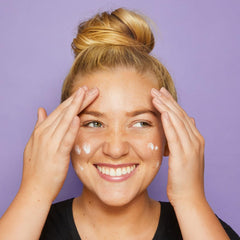 tarte base tape held in hand to show size and portable design benefit