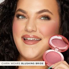 tarte swatch of Blushing Bride on skin demonstrating buildable color payoff and natural finish