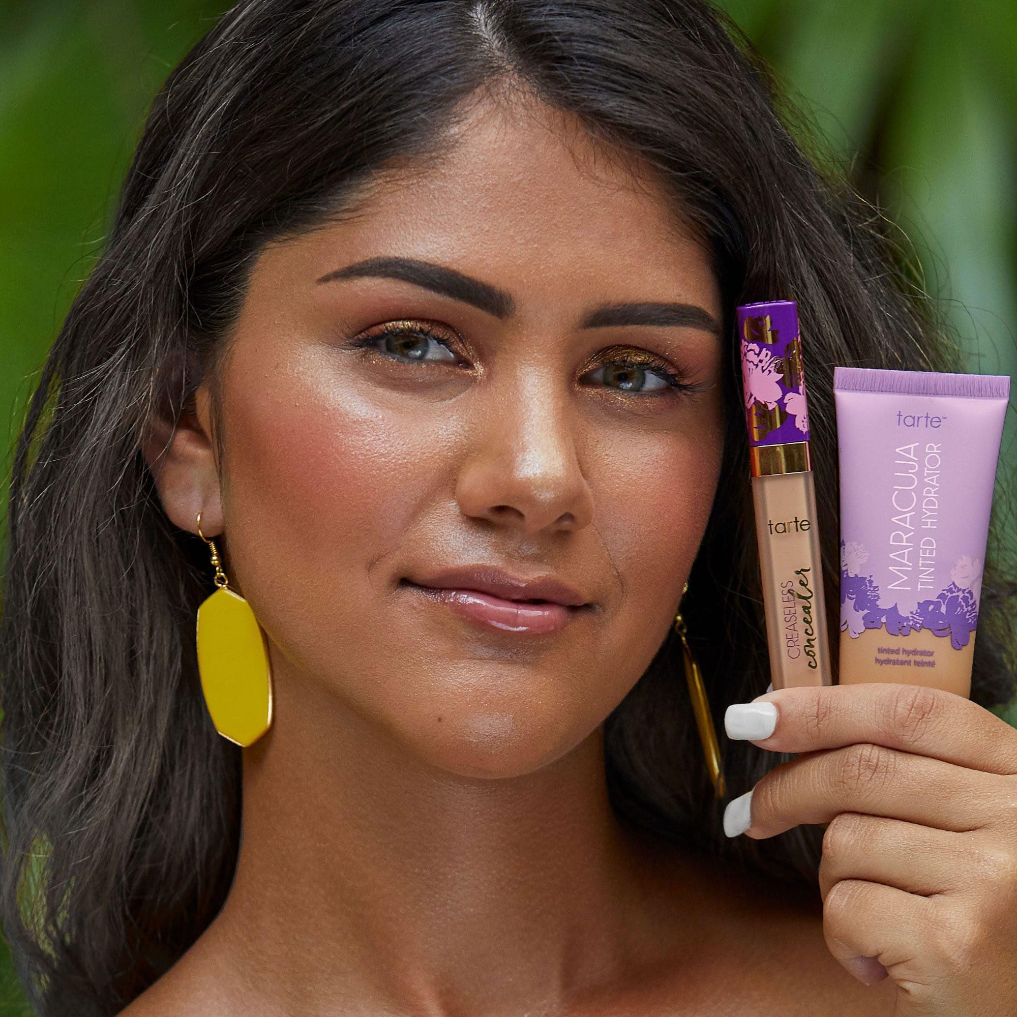 tarte applying tinted moisturizer with fingers for seamless coverage benefit