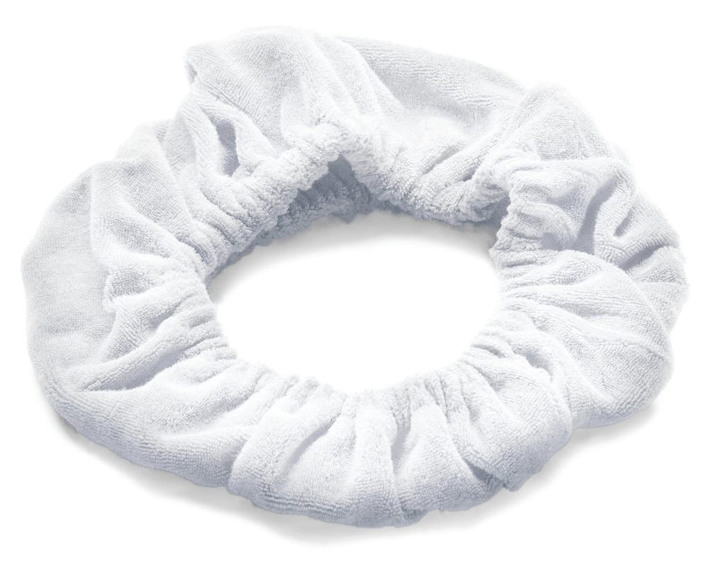 TASSI head wrap next to a ruler showing one-size fits most scale
