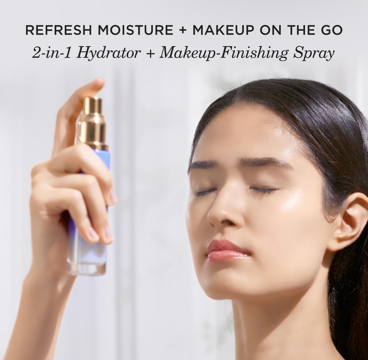 Tatcha mist spraying fine veil onto model for instant dewy hydration