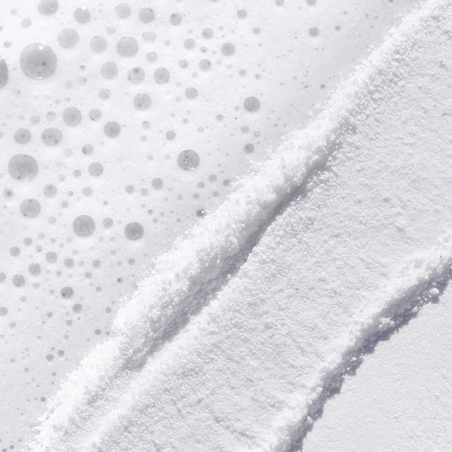 TATCHA powder texture close-up, shows fine rice bran particles for gentle polish
