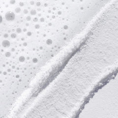 TATCHA powder texture close-up, shows fine rice bran particles for gentle polish