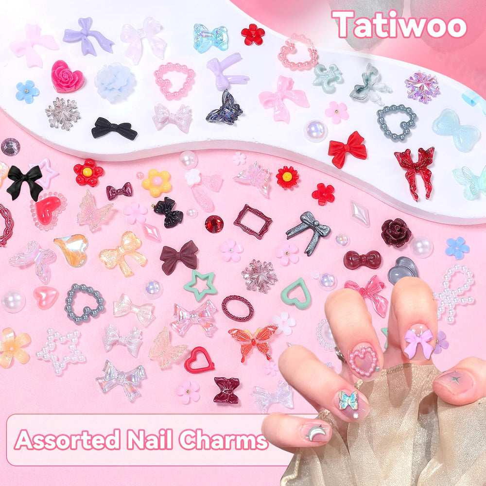Tatiwoo charms held in hand to show scale and portability for on-the-go manicures