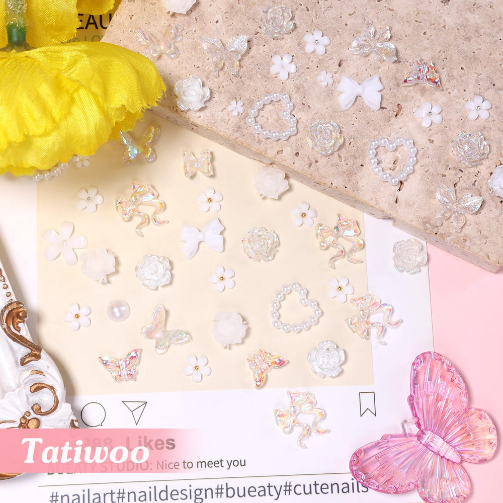 Tatiwoo hand holding charms for scale showing nail-ready sizes and easy placement