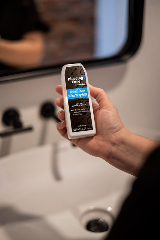 Tattoo Goo spray nozzle close-up showing precise mist for gentle cleansing
