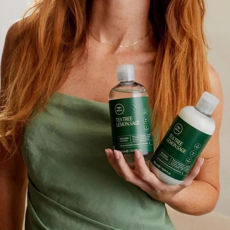 Tea Tree bottle on bathroom shelf near towel, lifestyle shot conveying fresh citrus herbal refresh