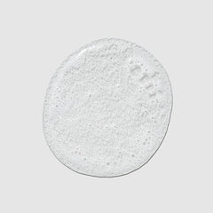 Tea Tree lemon and sage sprigs staged with bottle highlighting natural scent and scalp-invigorating benefits