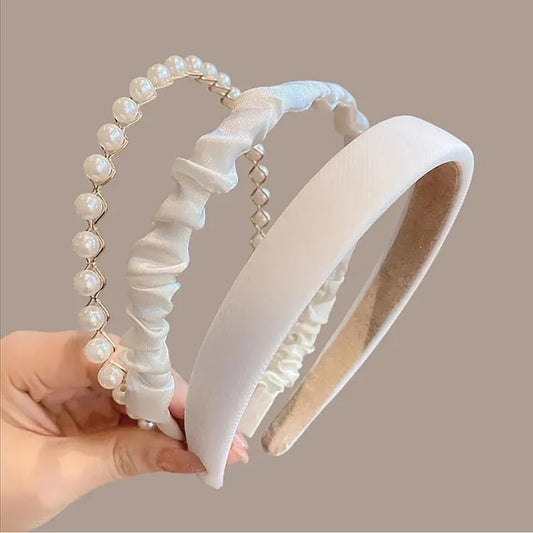 TEBIEKOY front view of three white pearl headbands showing elegant set and benefit
