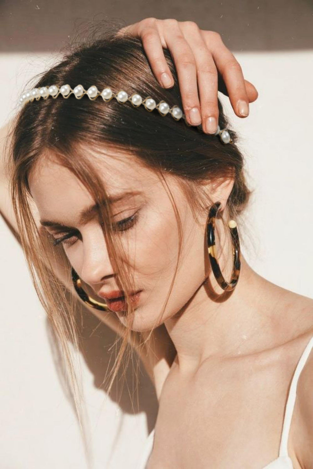TEBIEKOY headband held in hand to show size and lightweight portability benefit