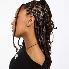 TEBIEKOY on a braided hairstyle showing festival-ready sparkle and dimension
