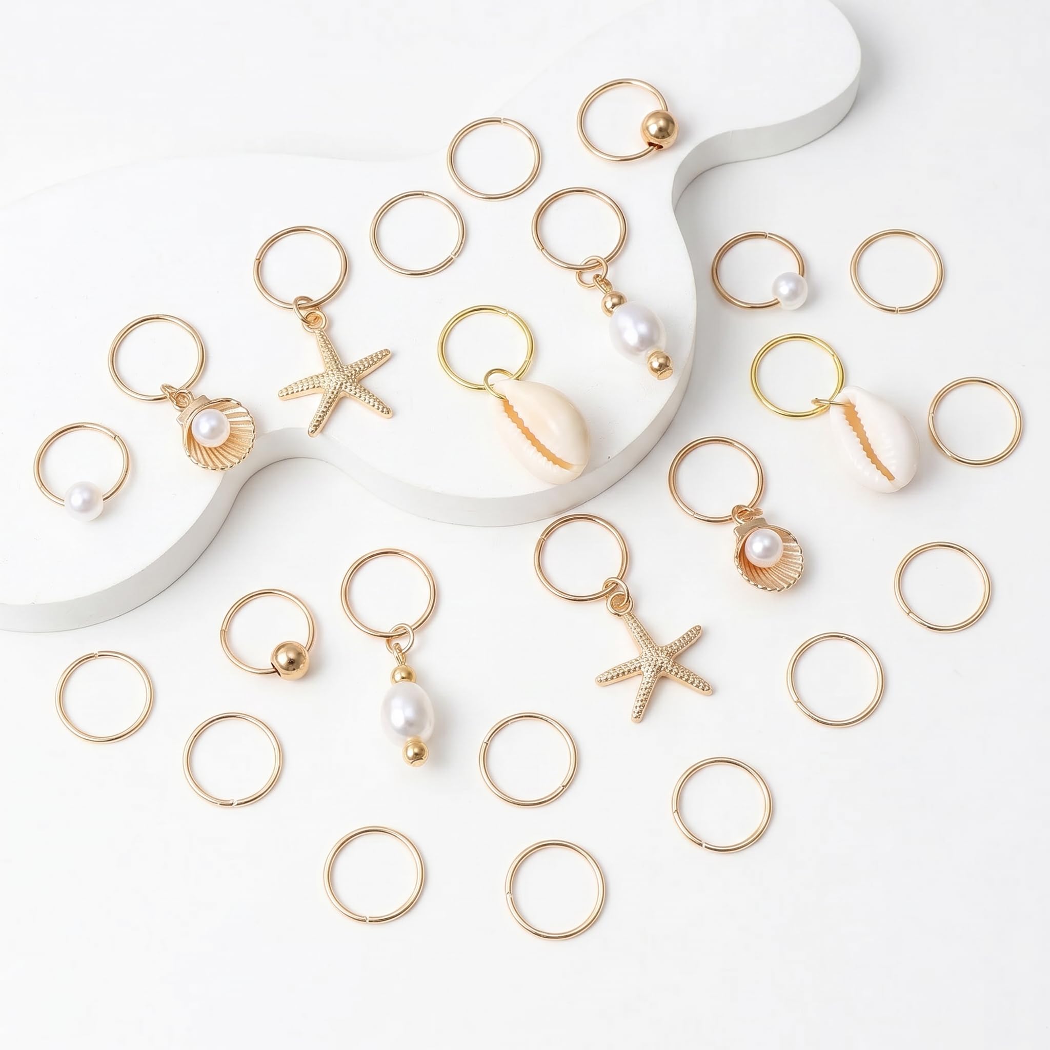 TEBIEKOY detailed close-up of starfish shell and conch charms, shows craftsmanship