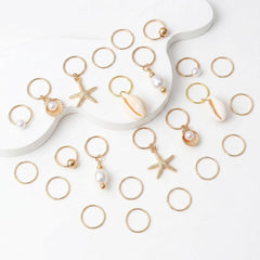 TEBIEKOY detailed close-up of starfish shell and conch charms, shows craftsmanship
