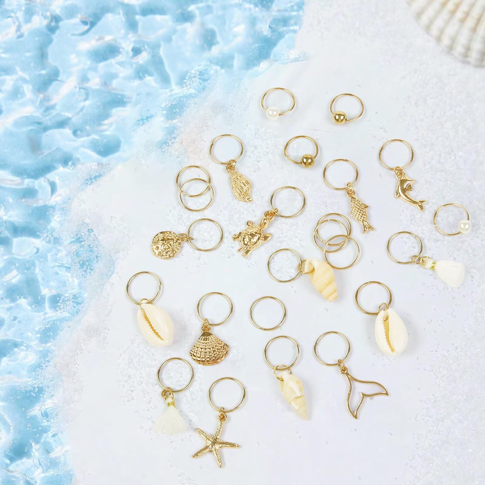 TEBIEKOY charms displayed on hand for scale showing light weight and portability