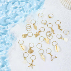 TEBIEKOY charms displayed on hand for scale showing light weight and portability