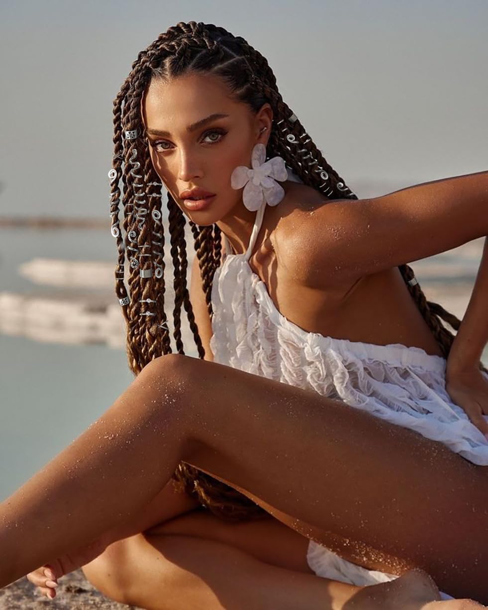 TEBIEKOY styled on multiple braids in festival outfit showing bold accent