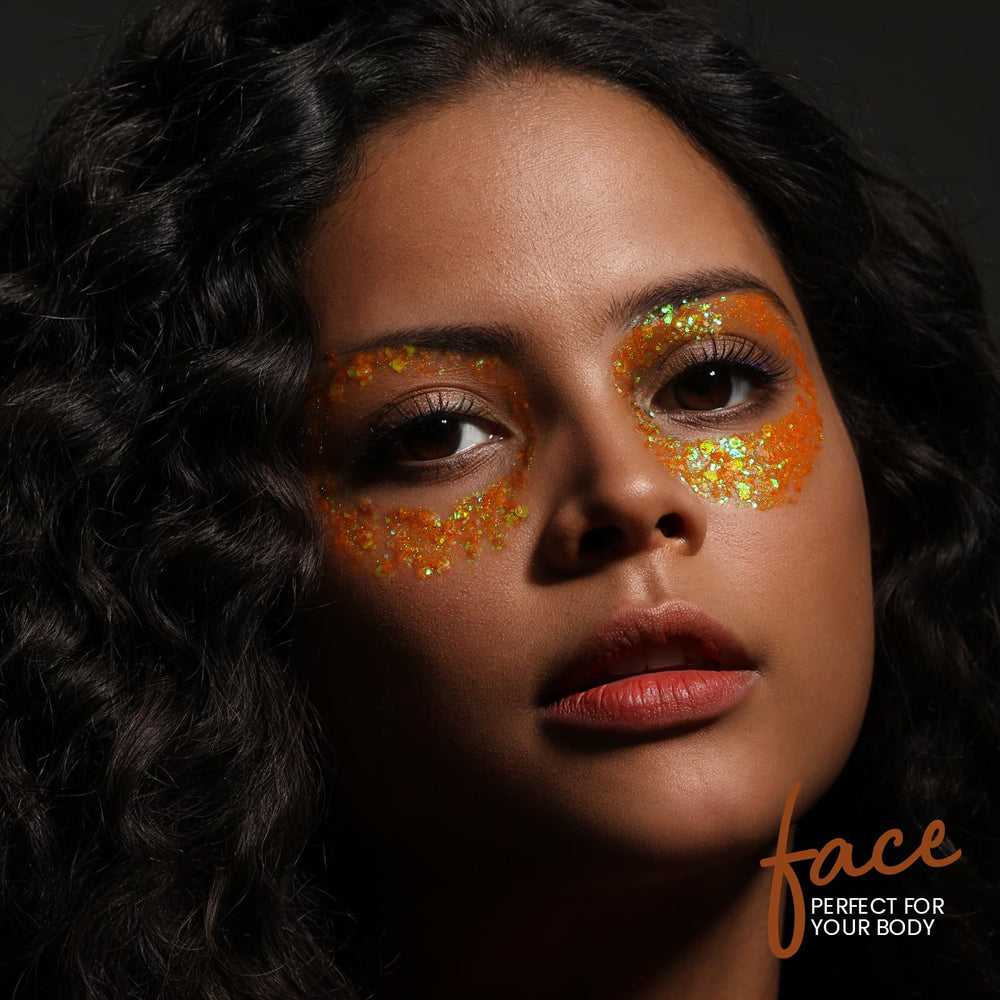 Teenitor model applying orange face glitter for bold festival look