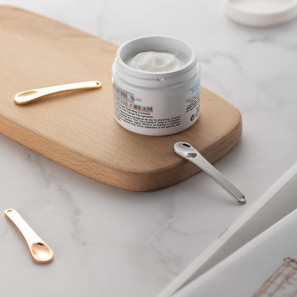 Tekson scooping skincare cream demonstrating sanitary application without fingers
