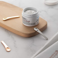 Tekson scooping skincare cream demonstrating sanitary application without fingers