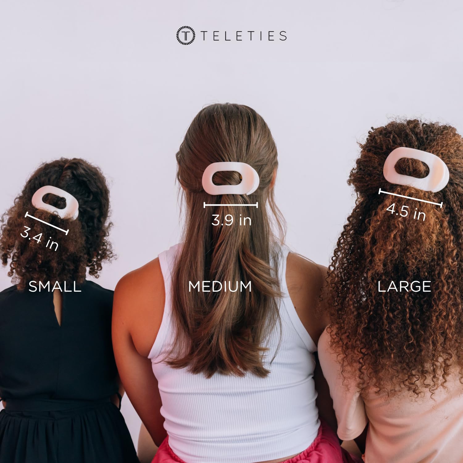 TELETIES clip beside a hand showing medium size and real-world scale