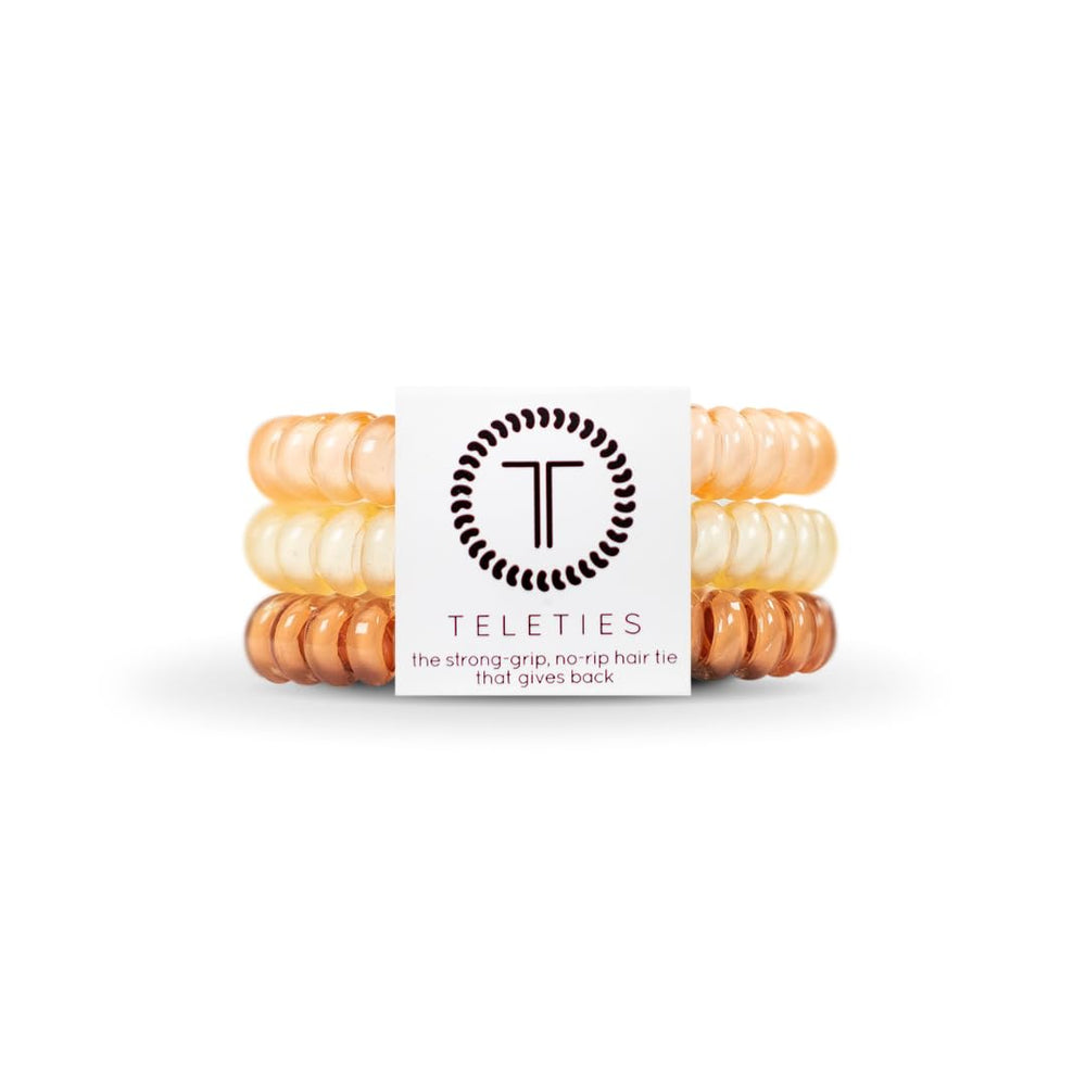 TELETIES front packaging showing three small nude coils and benefits